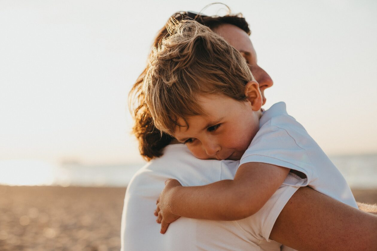 foster carer hugs foster child