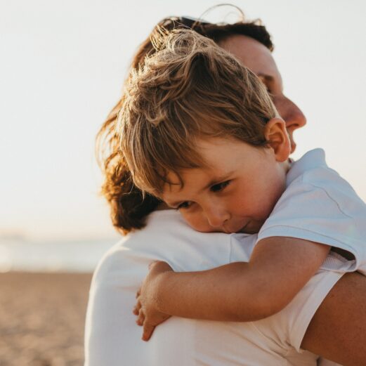 foster carer hugs foster child